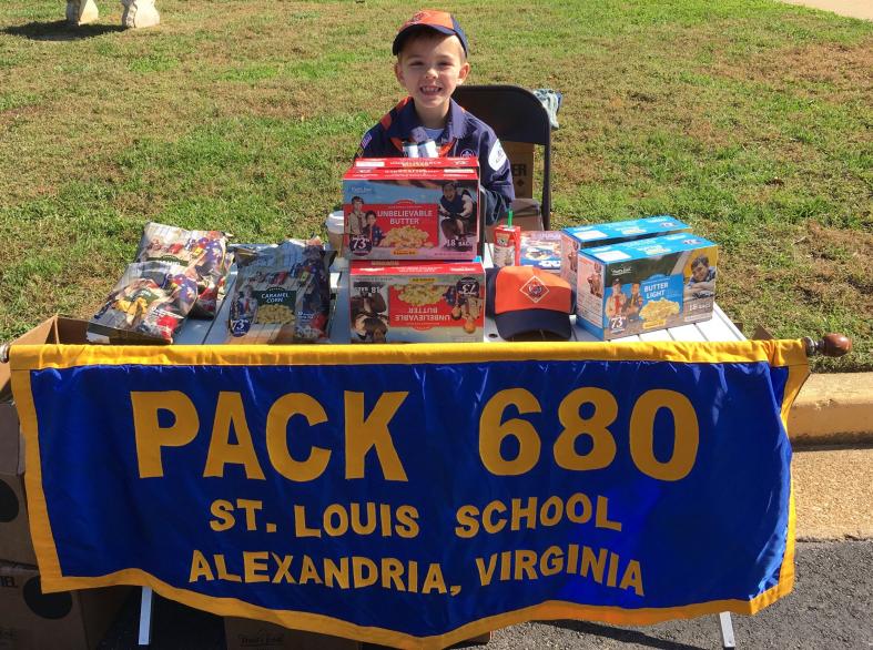 A Cub Scout selling popcorn