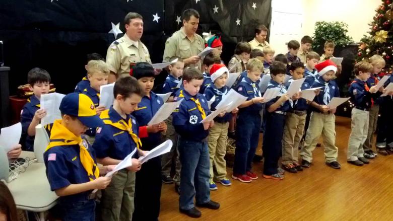 Scouts singing Christmas carols